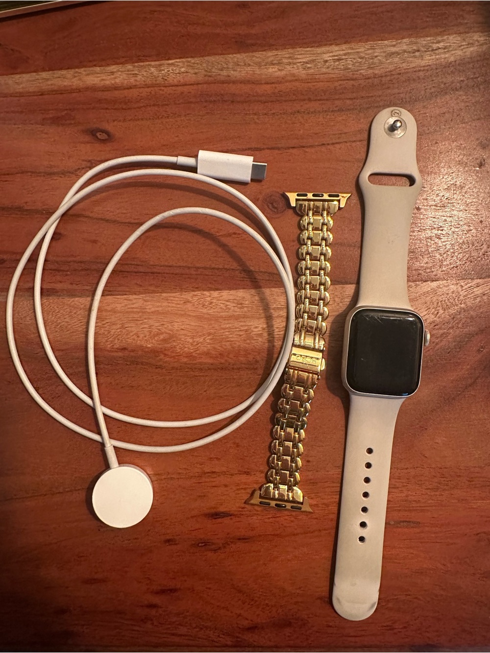 Apple Watch with white Sport Band and Gold Link Bracelet